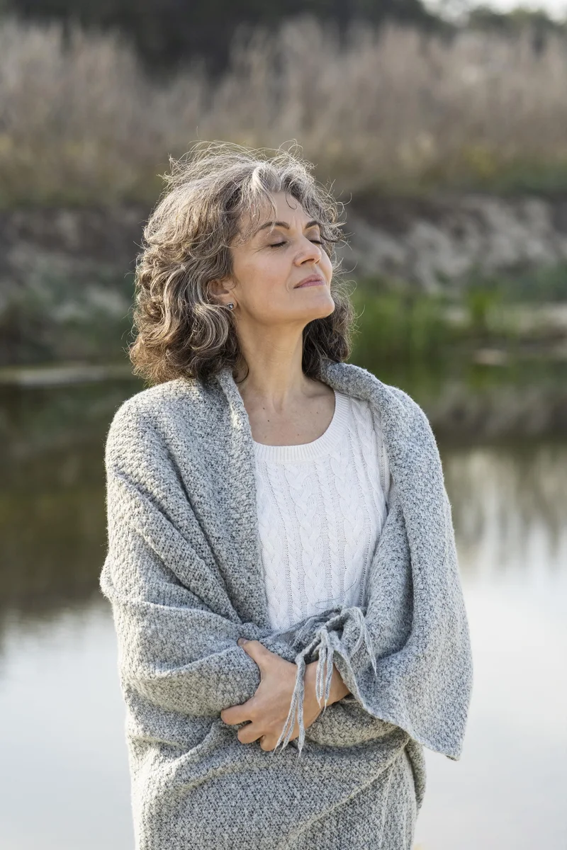 portrait-older-woman-outdoors-by-lake