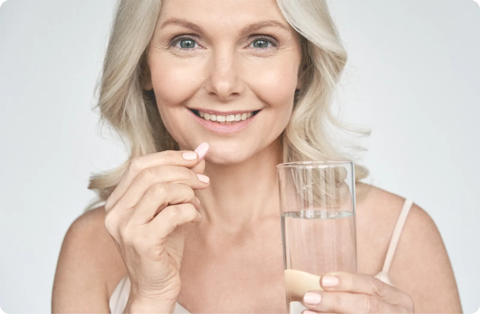 Woman holding capsule