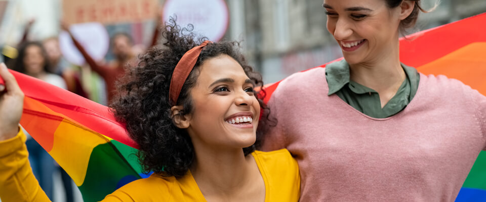 Same sex couple with pride flag