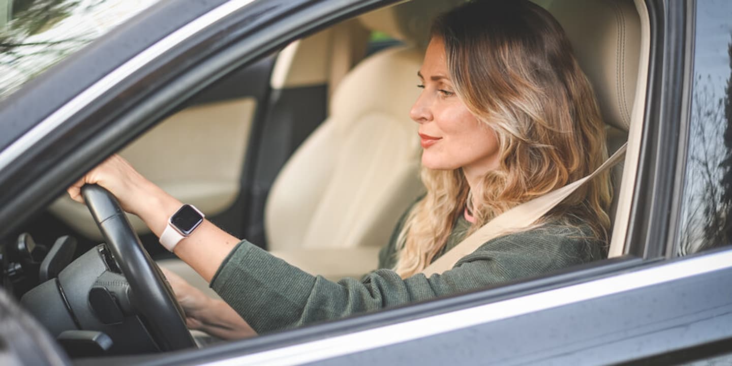 Woman driving car.