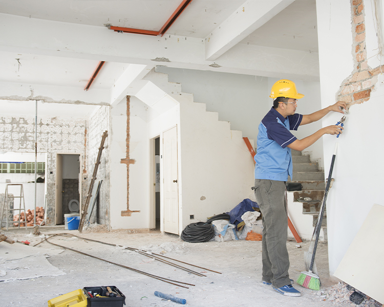 Builder renovating house