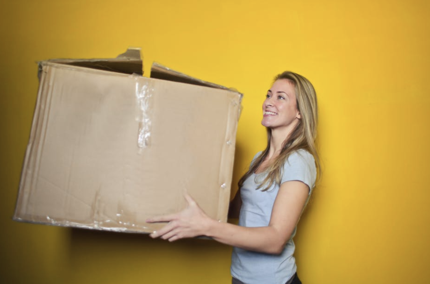 Woman holding a large box