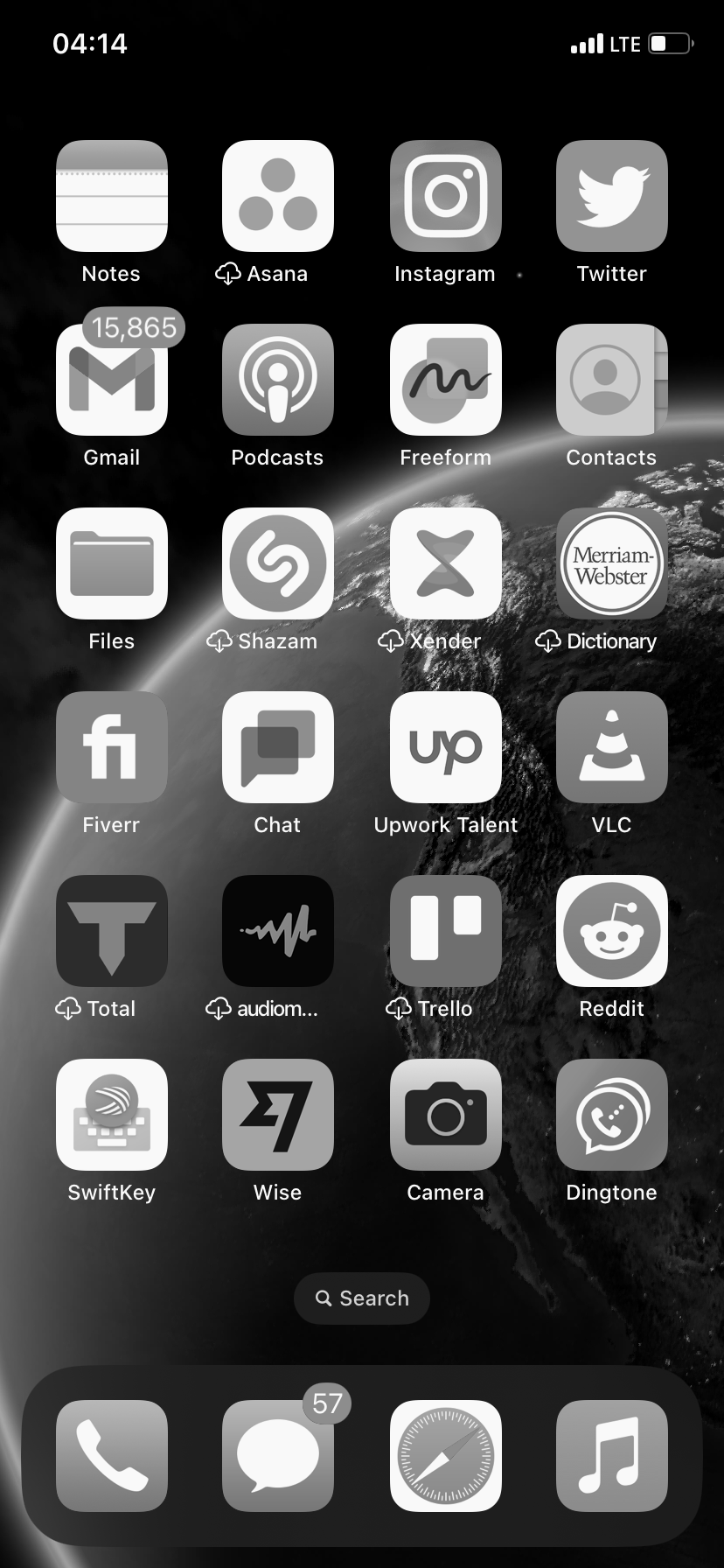 An iPhone home screen with a grayscale background and icons