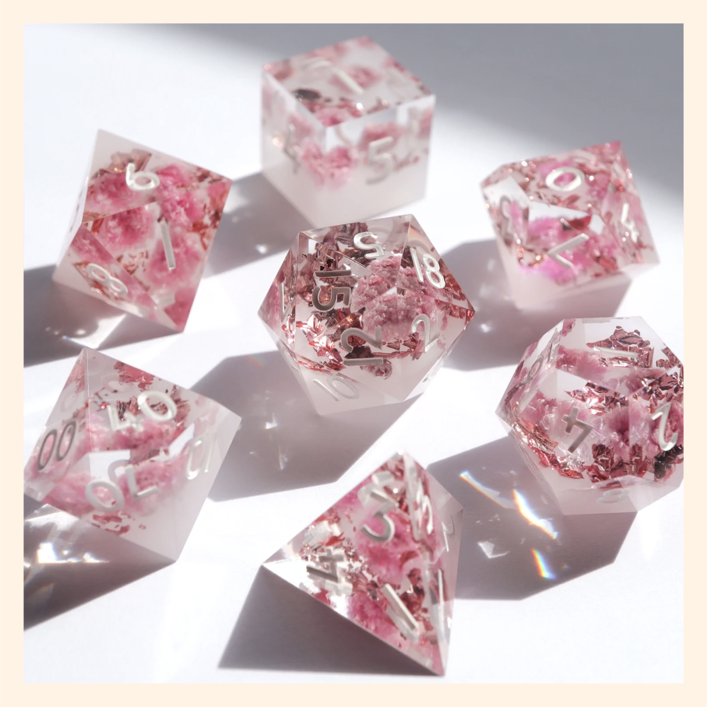 Acryllic Dungeons and Dragons dice set inlaid with gold foil and real pink flowers