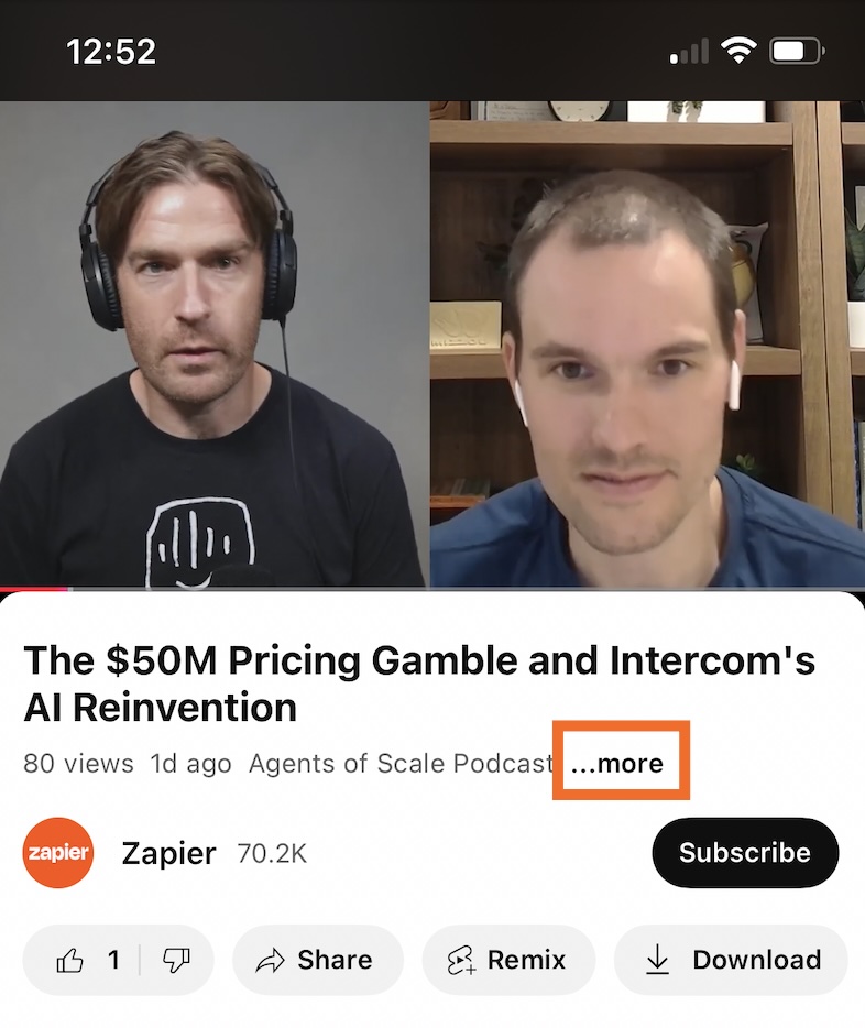Screenshot showing the description box under the YouTube video with an orange box around it on mobile