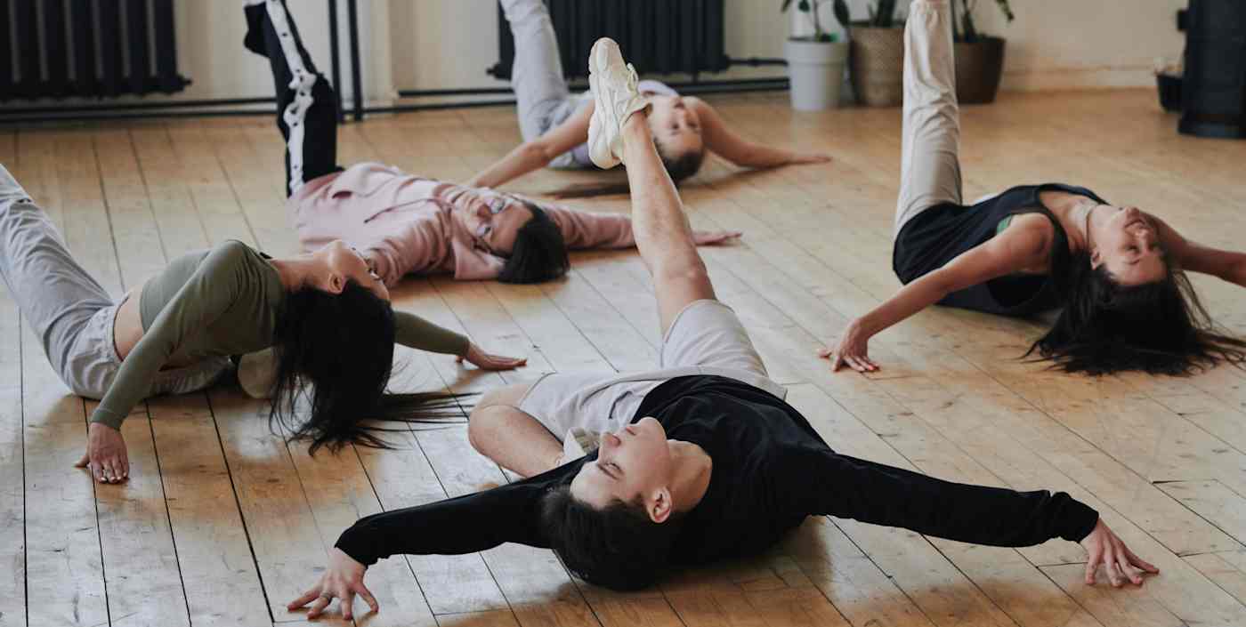 Hero image of people in a studio dancing