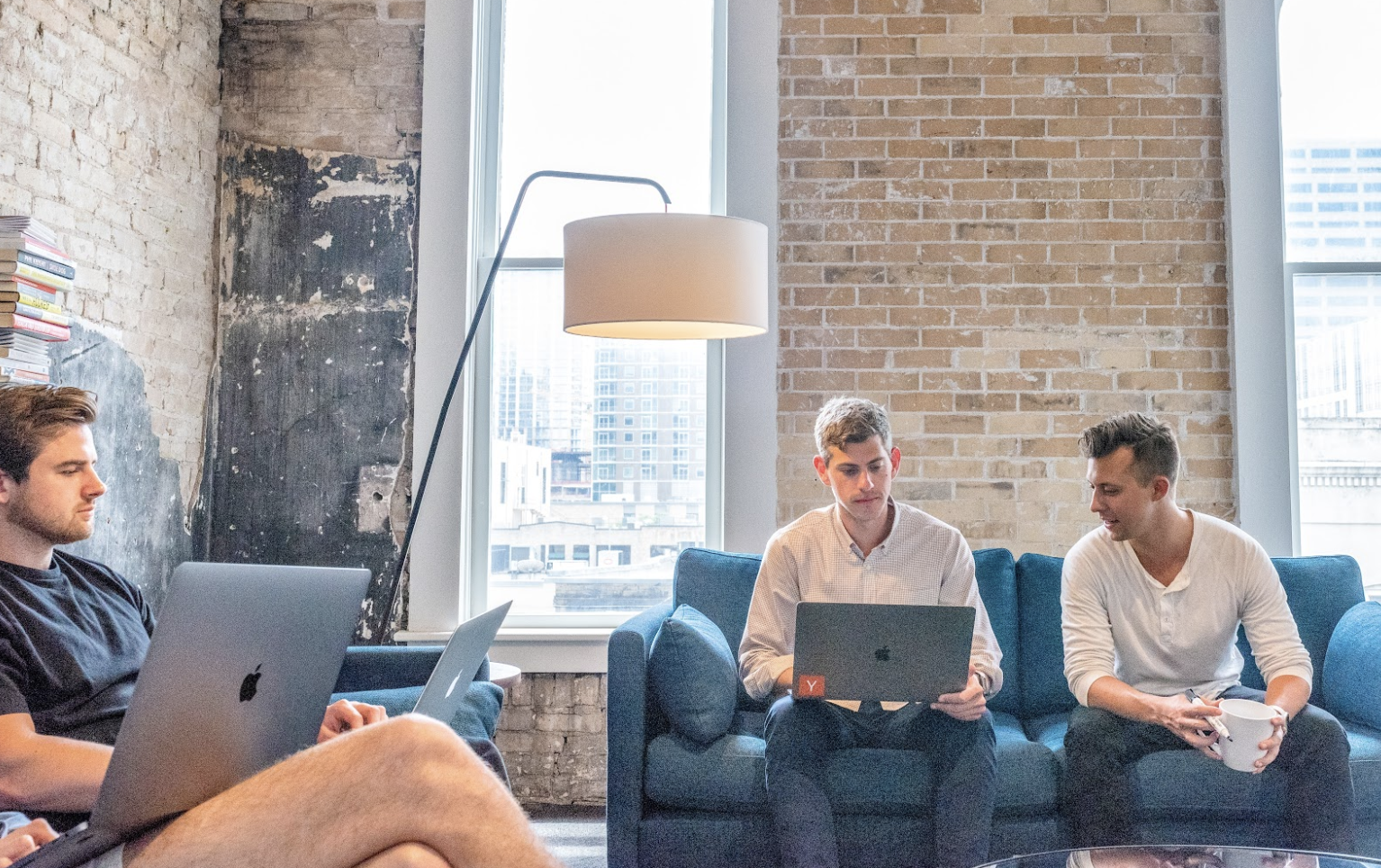People sitting on couches in an office