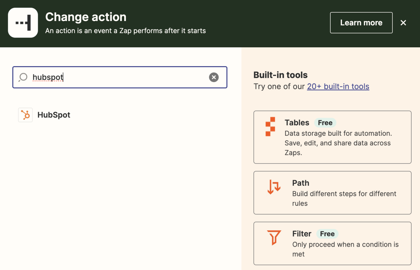 An action step in the Zap editor with HubSpot added to the action app search field.
