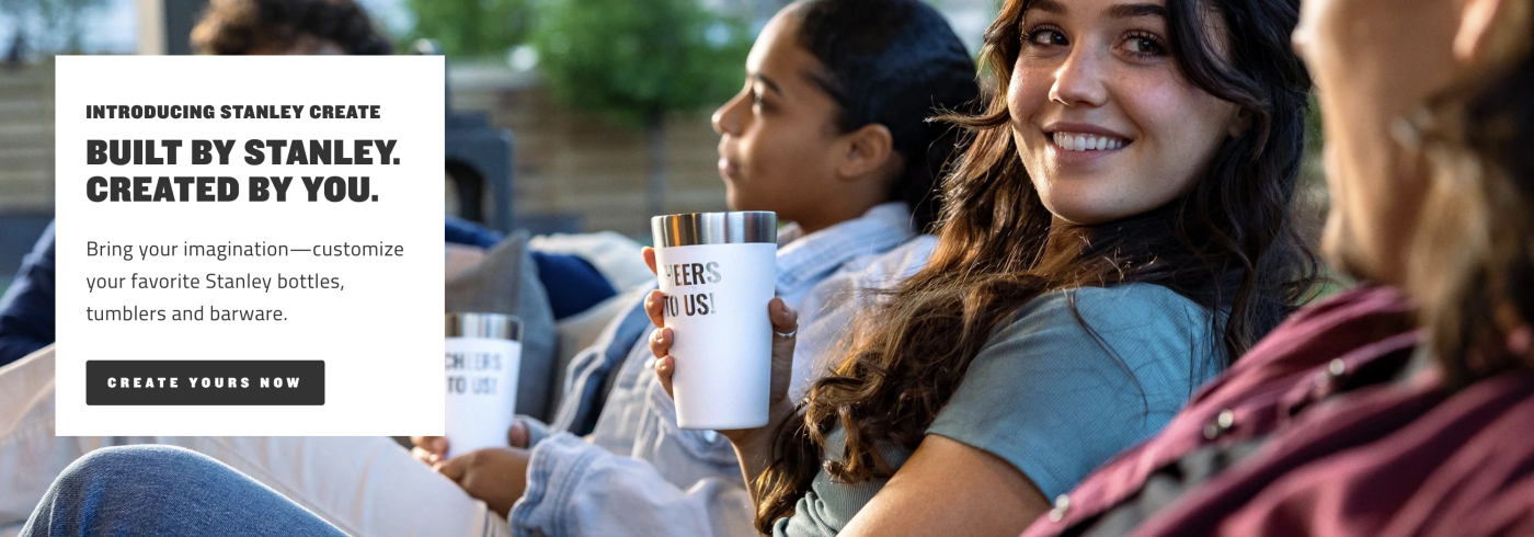 Friends holding Stanley cups and smiling with the text: "Introducing Stanley Create. Built by Stanley. Created by You. Bring your imagination—customize your favorite Stanley bottles, tumblers and barware." 