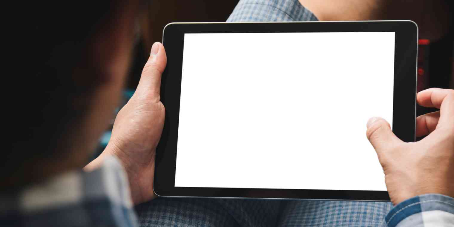 Hero image of a blank iPad held by a person