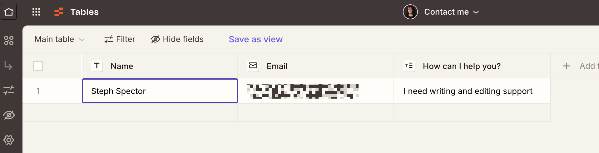 A view of a Zapier table called "Contact me" with one row listing a name, email, and help request message