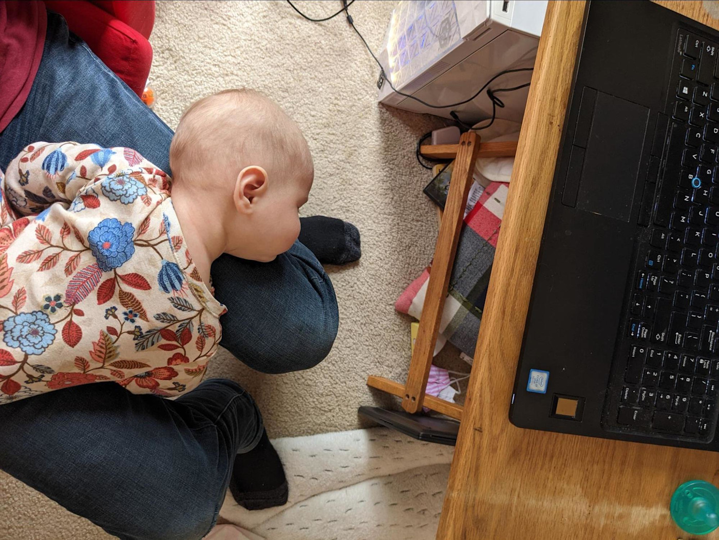 Jessica's baby on her lap at her desk