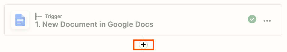 The Zap editor with a plus-size highlighted with an orange box underneath a Google Docs trigger step.