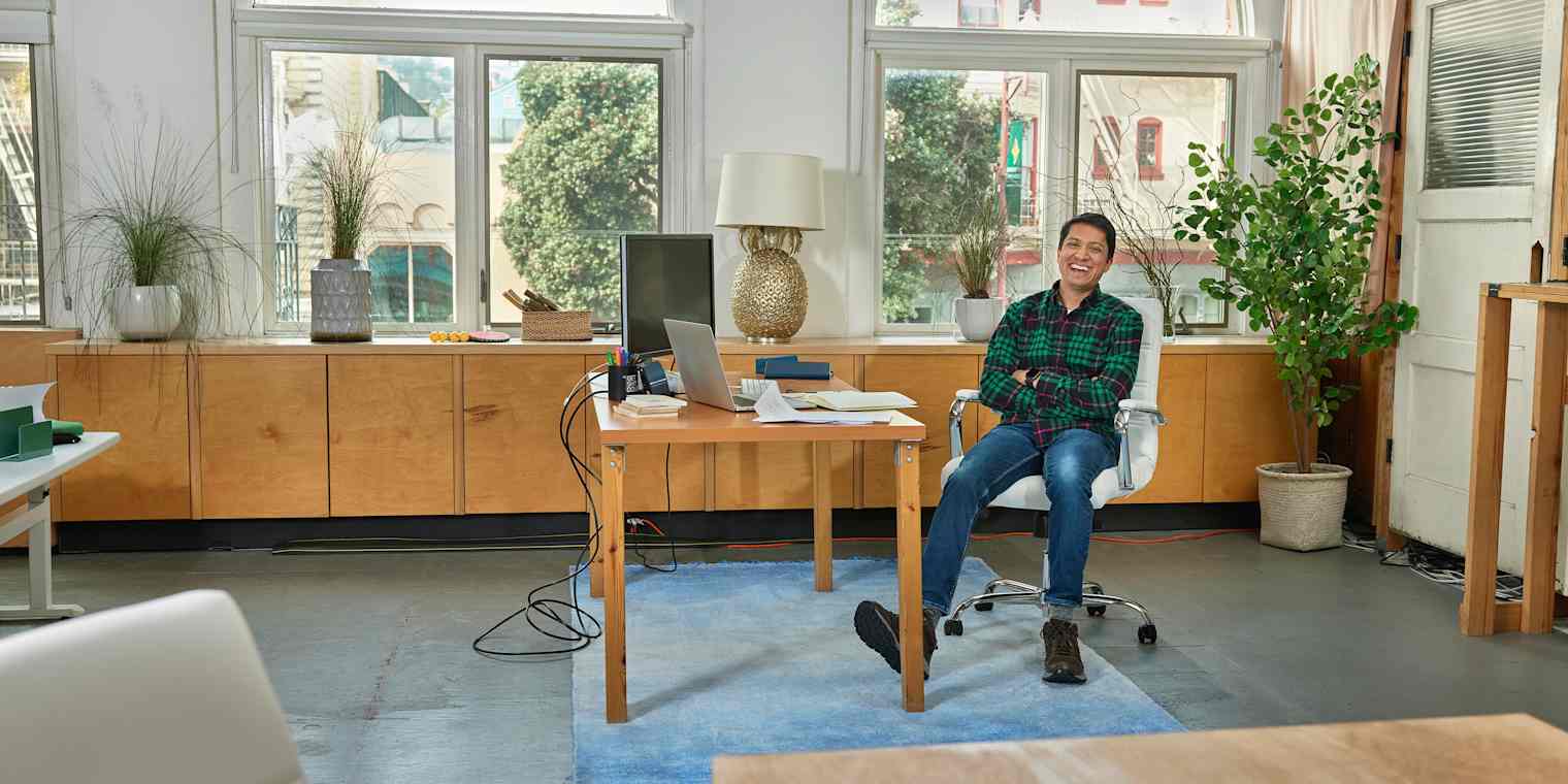 Digioh CEO Rishi Shah at his desk, smiling