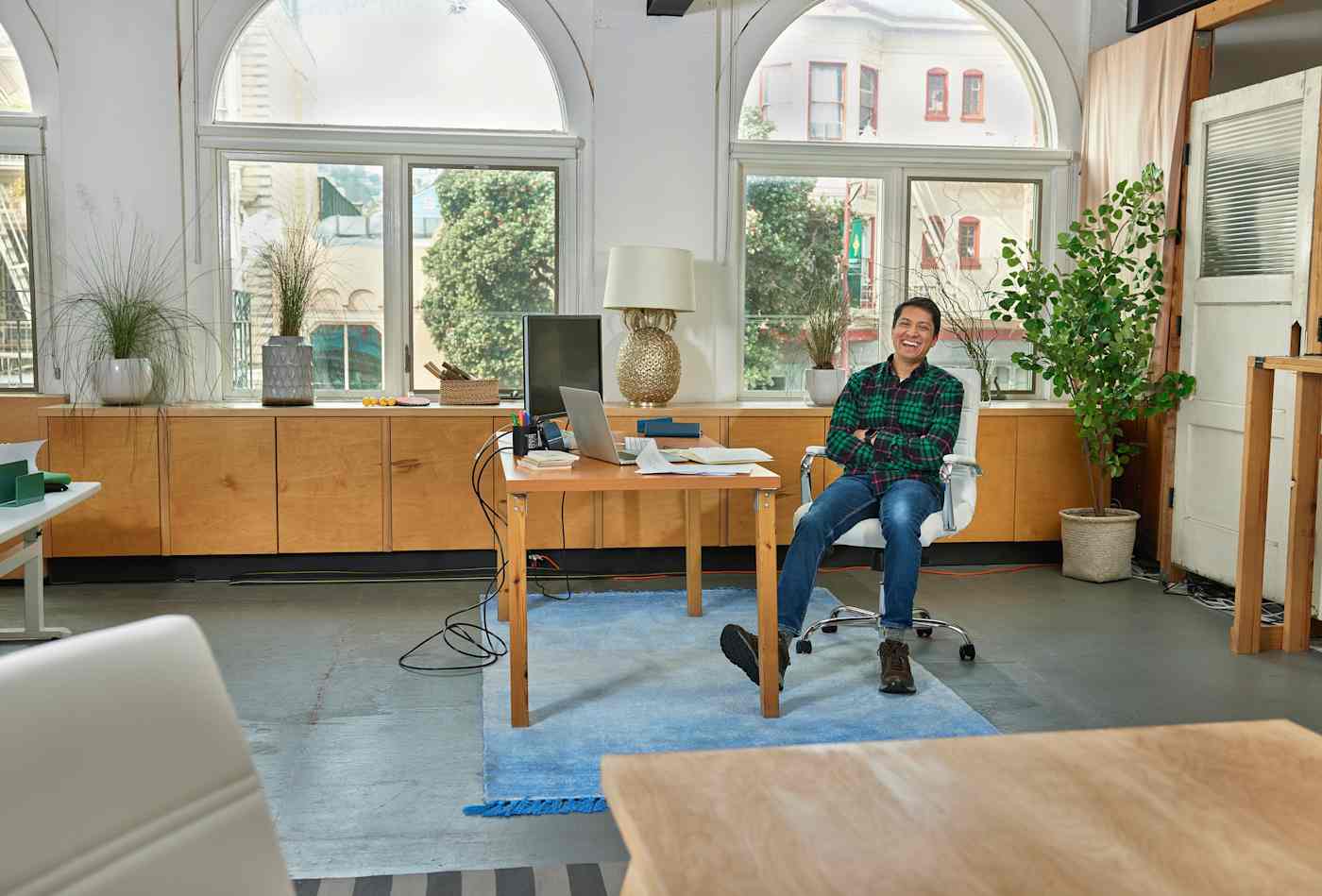 Digioh CEO Rishi Shah at his desk, smiling