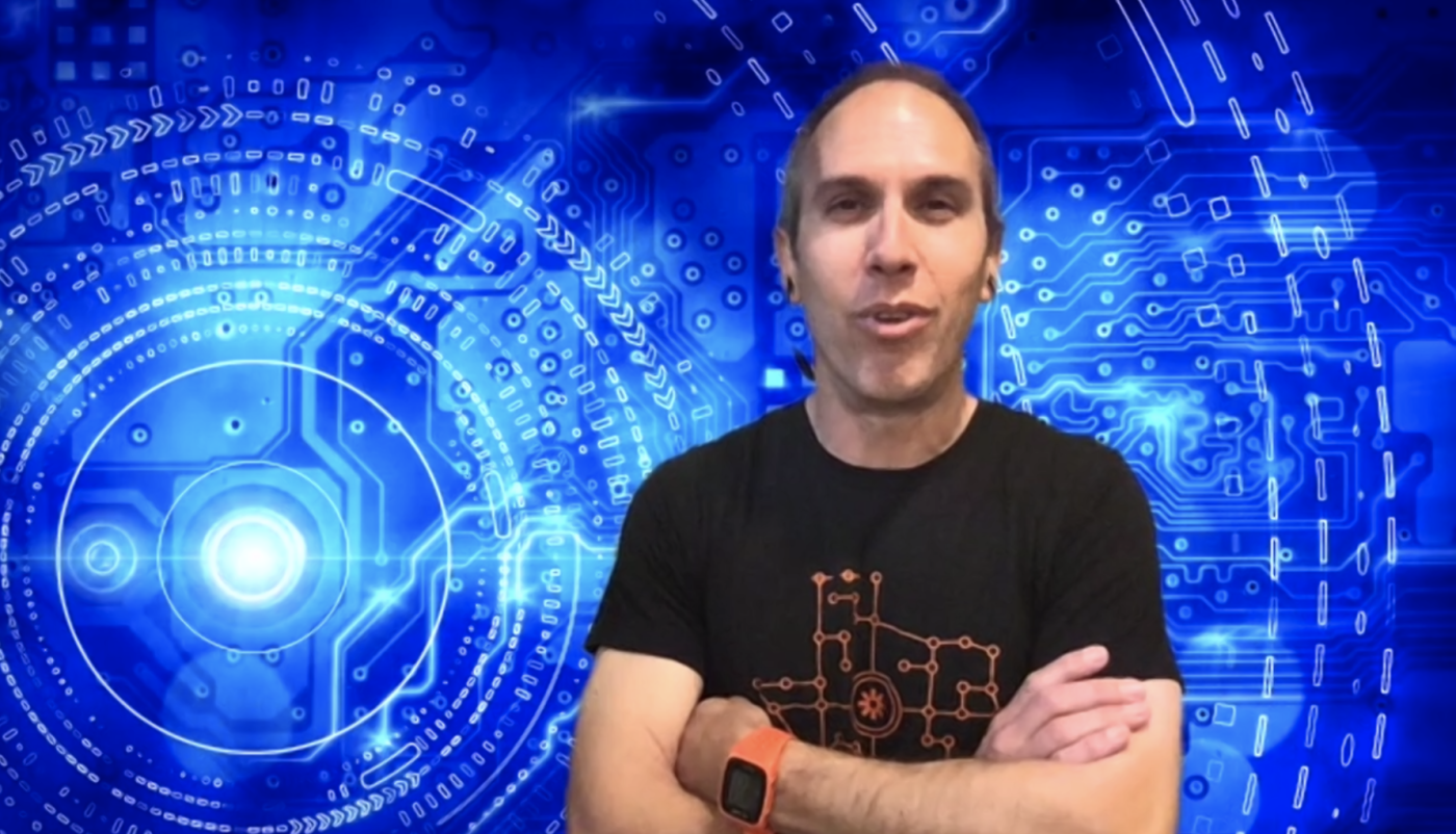 Ben in front of a circuit board background