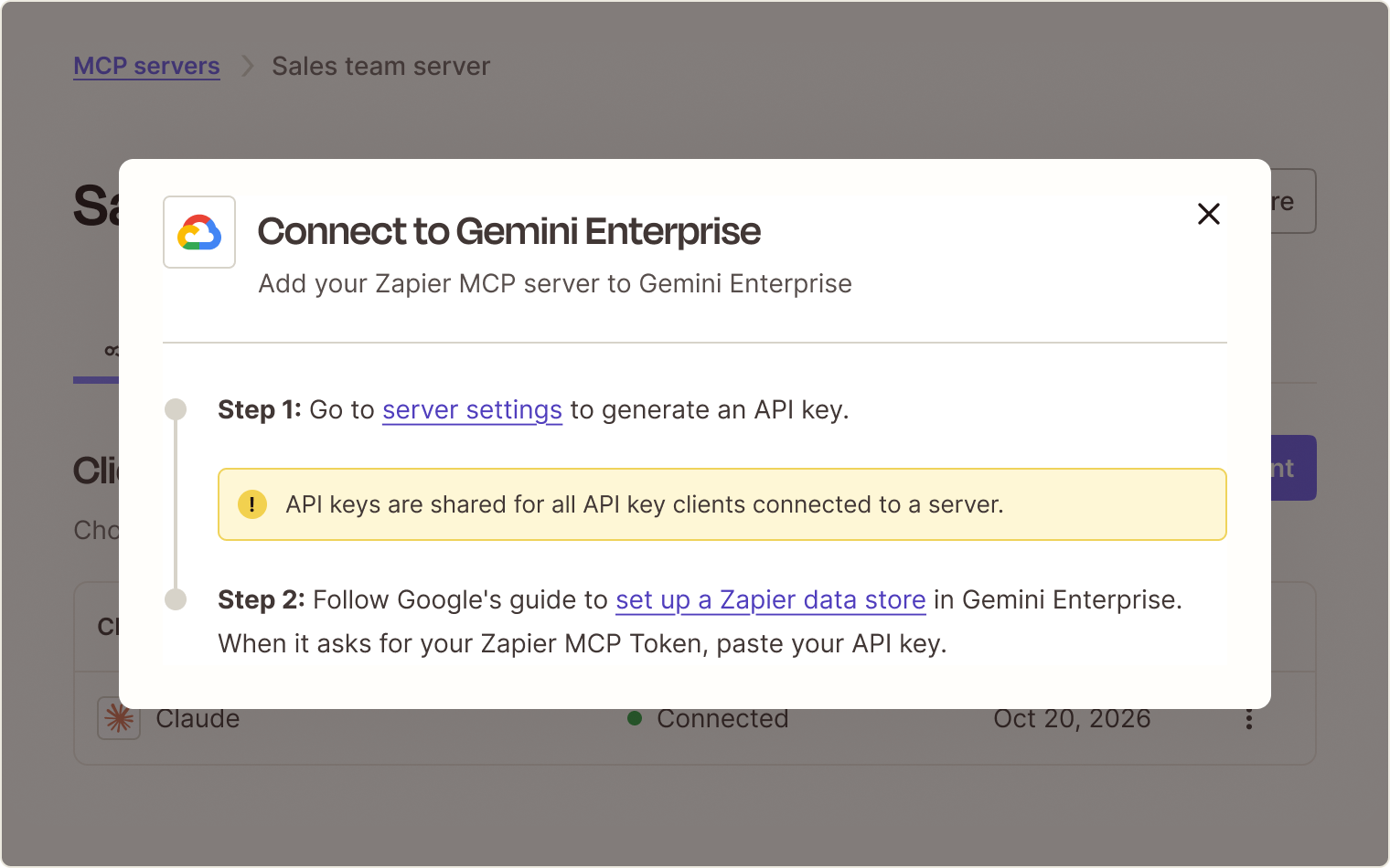 Illustration of the Connect to Gemini Enterprise dialog in Zapier MCP, with Step 1 to generate an API key in server settings, a note that API keys are shared across API key clients, and Step 2 to set up a Zapier data store in Gemini Enterprise.