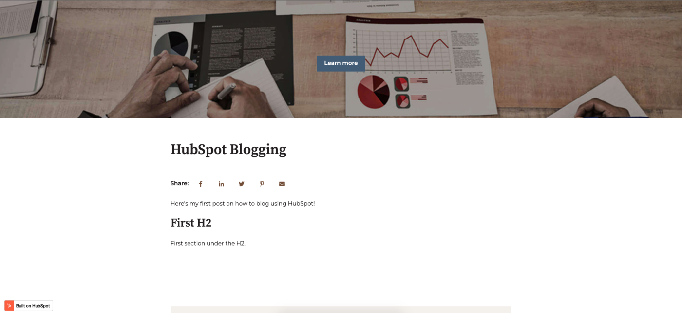 Screenshot of the blogging feature on HubSpot, with a banner photo showing someone writing and blank space below for writing the blog post