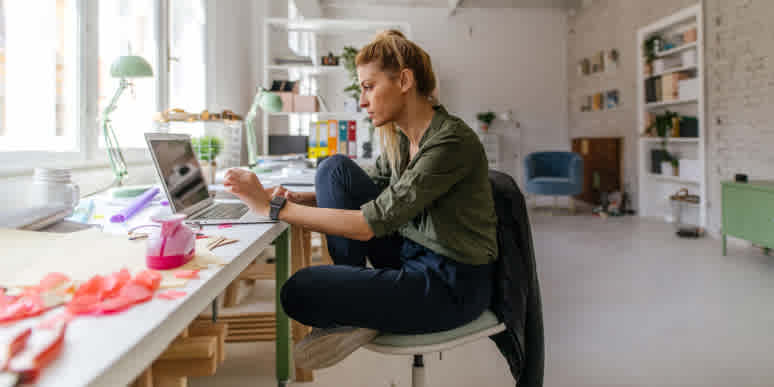 Hero image showing a person typing at their computer