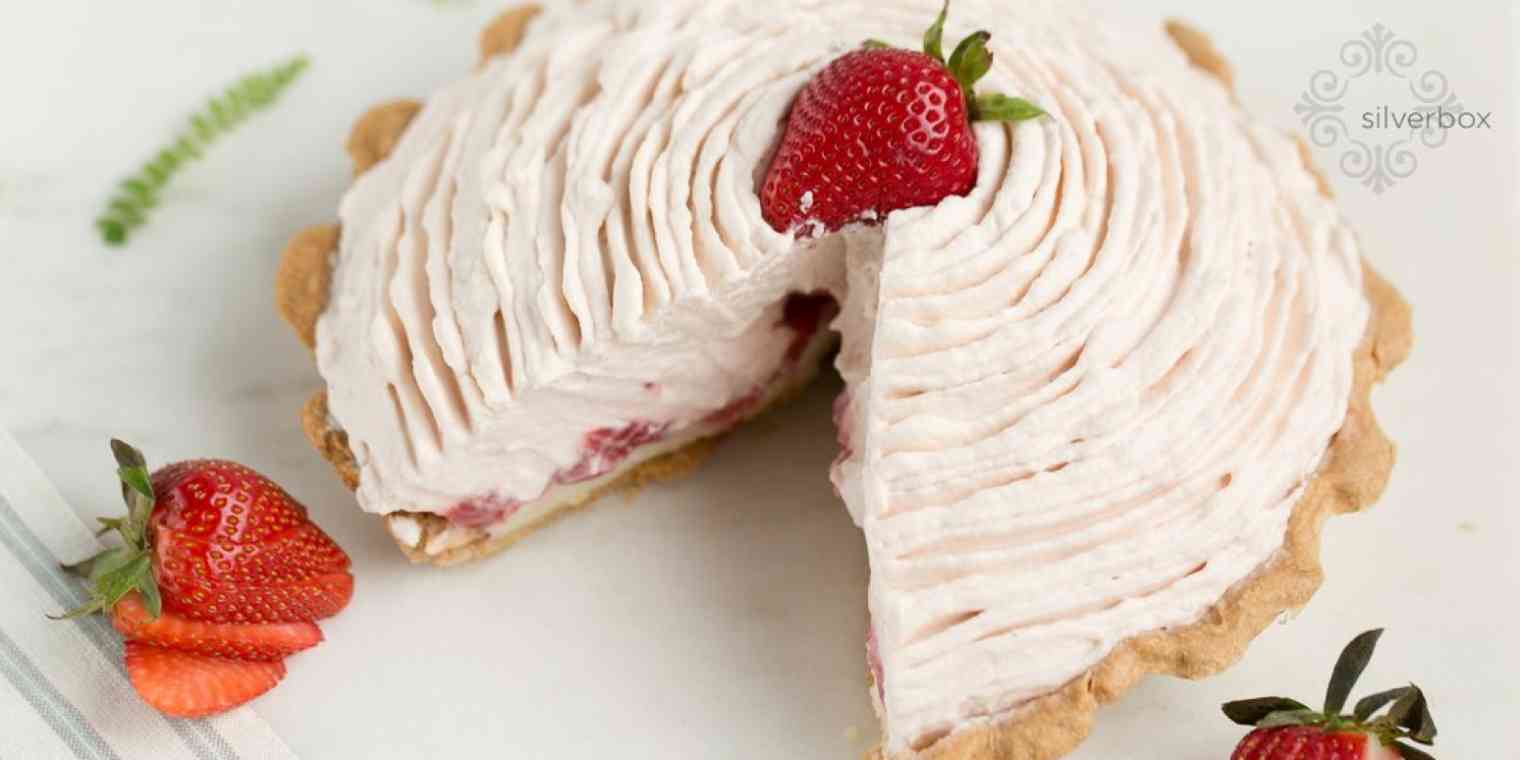 Hero image of a pink pie with strawberries