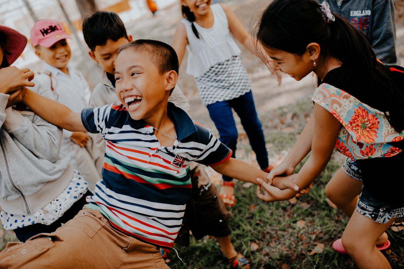 Photo of children tugging another child