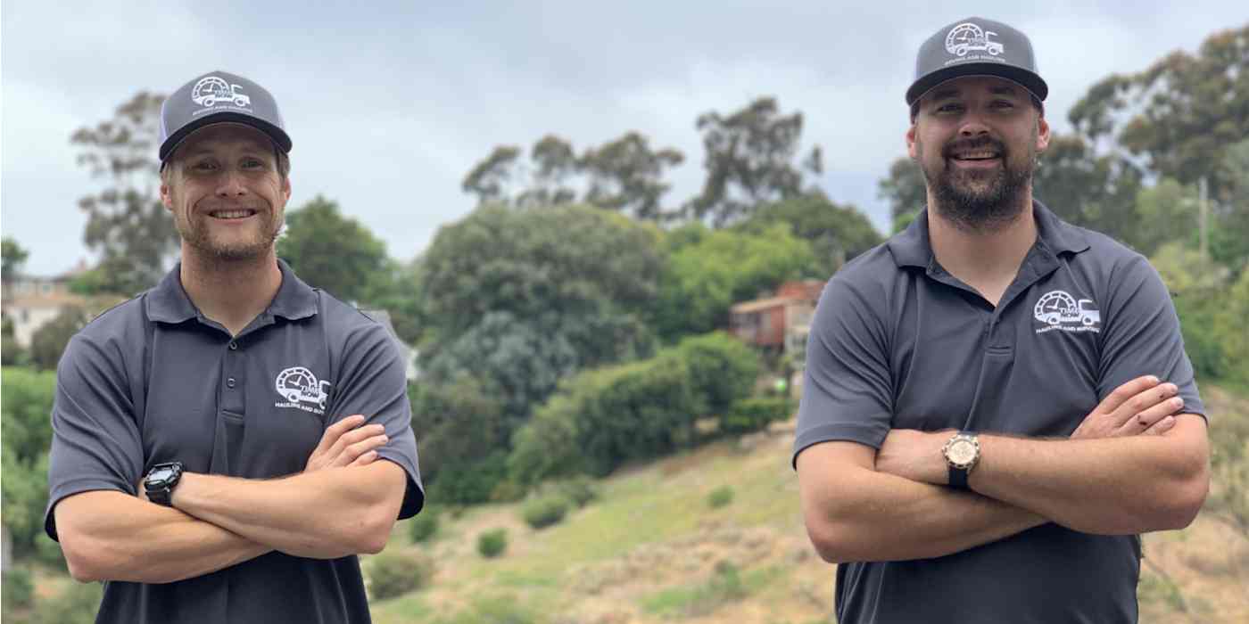 Hero image of two men with arms crossed, looking at the camera