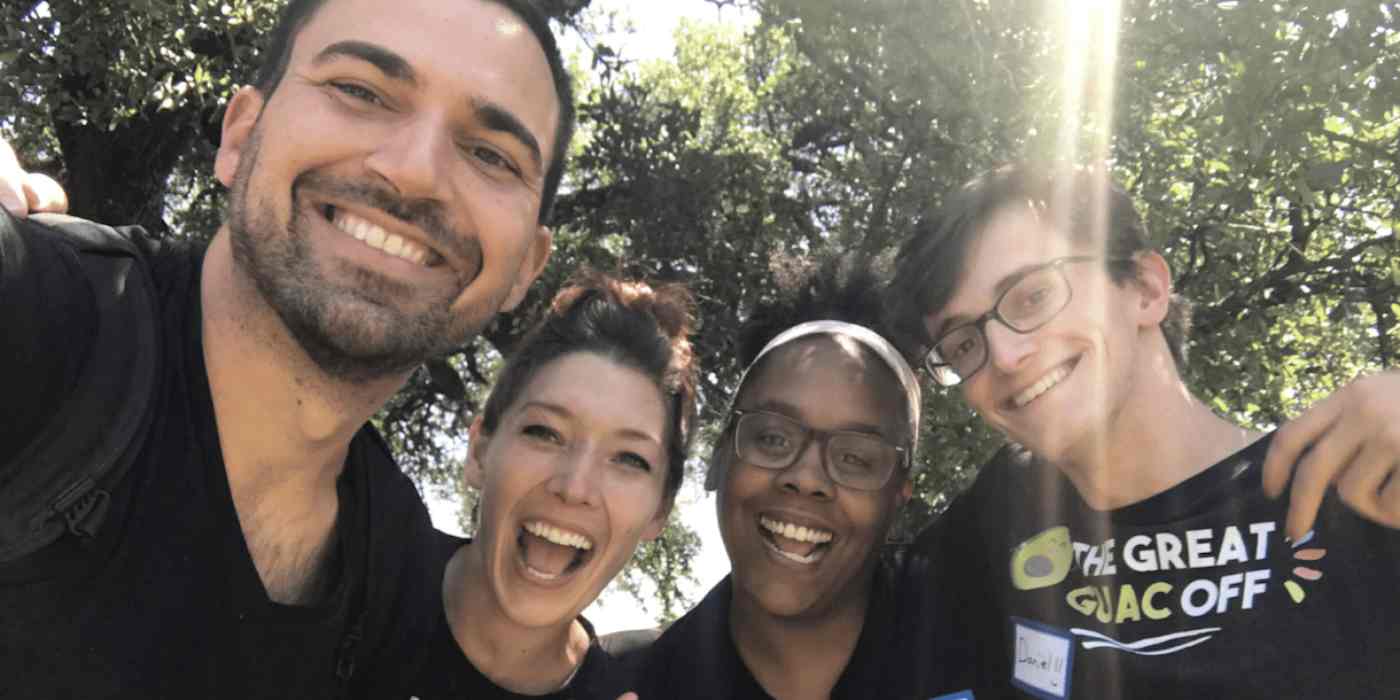 Hero image of the teambuilding.com team taking a selfie outside