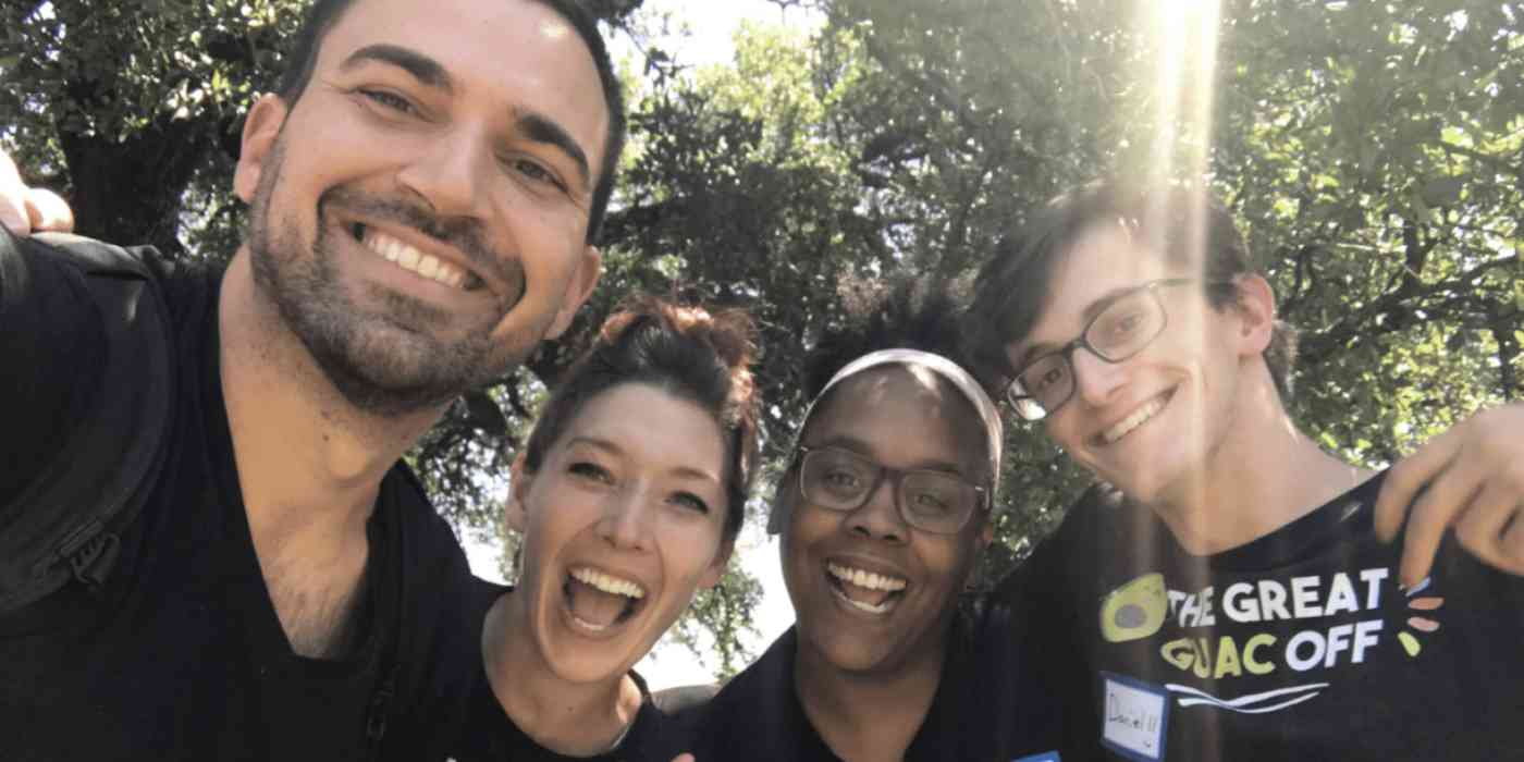 Hero image of the teambuilding.com team taking a selfie outside