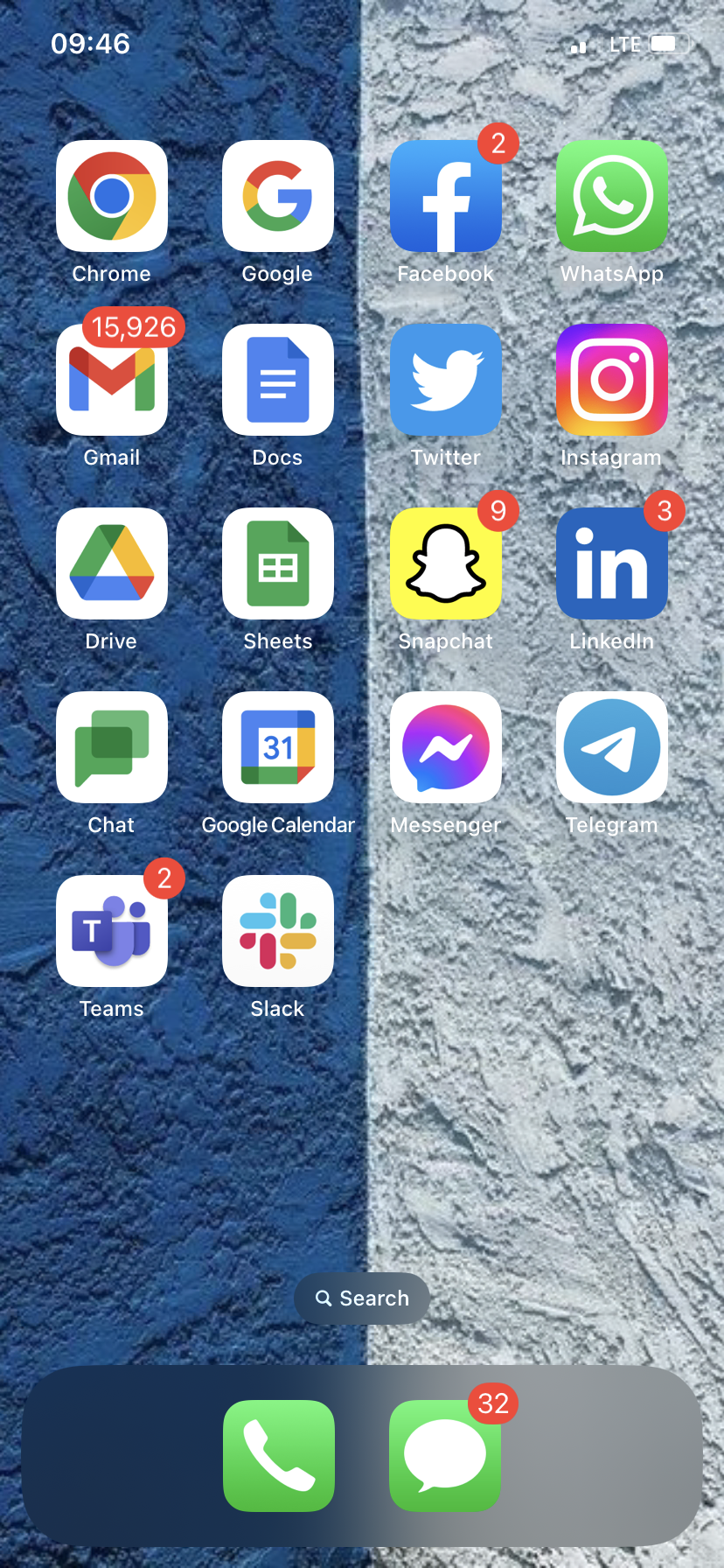 An iPhone home screen that's split down the middle by wallpaper