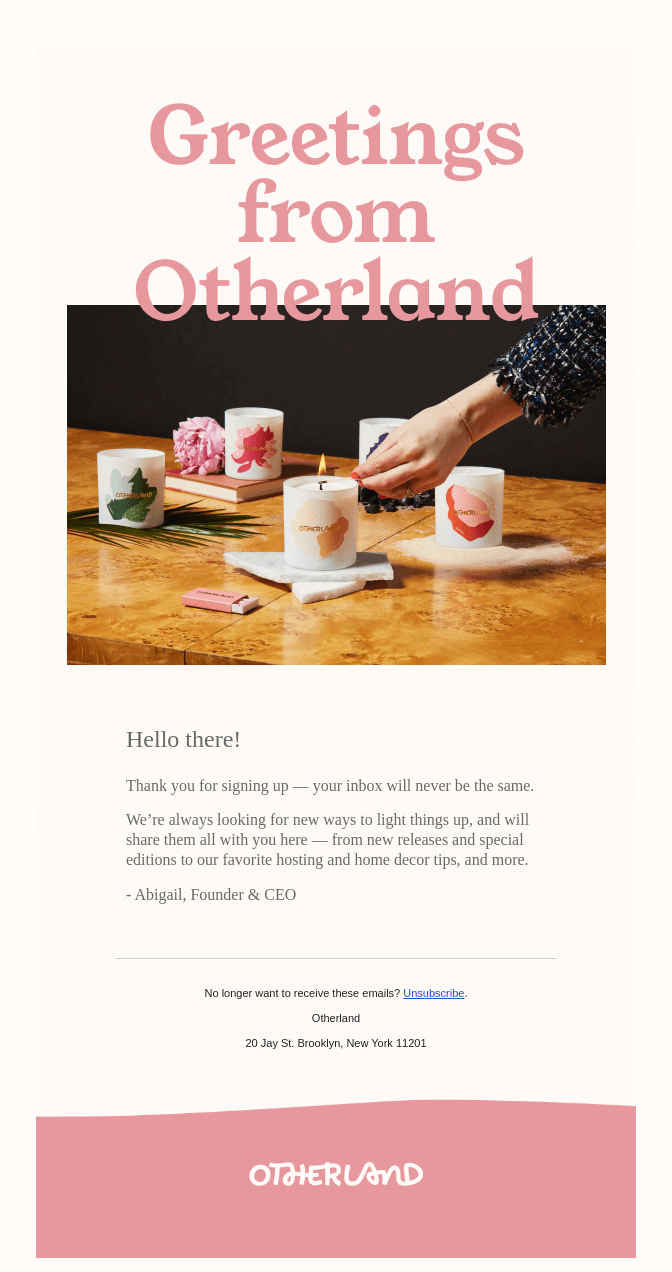 Greeting email with the heading Greetings from Otherland and a picture of a hand lighting candles.