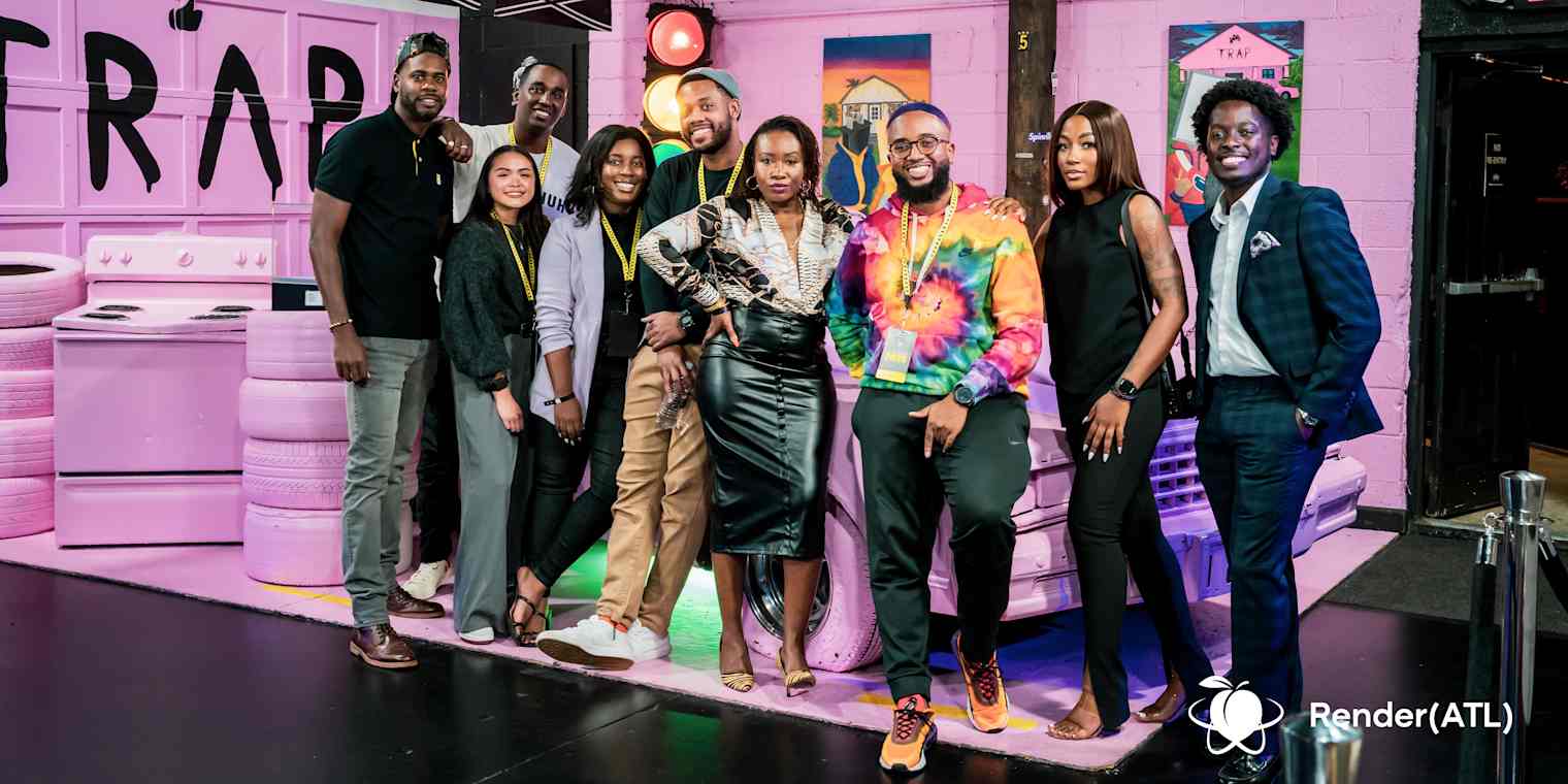 The Render-Atlanta team stands together, smiling.