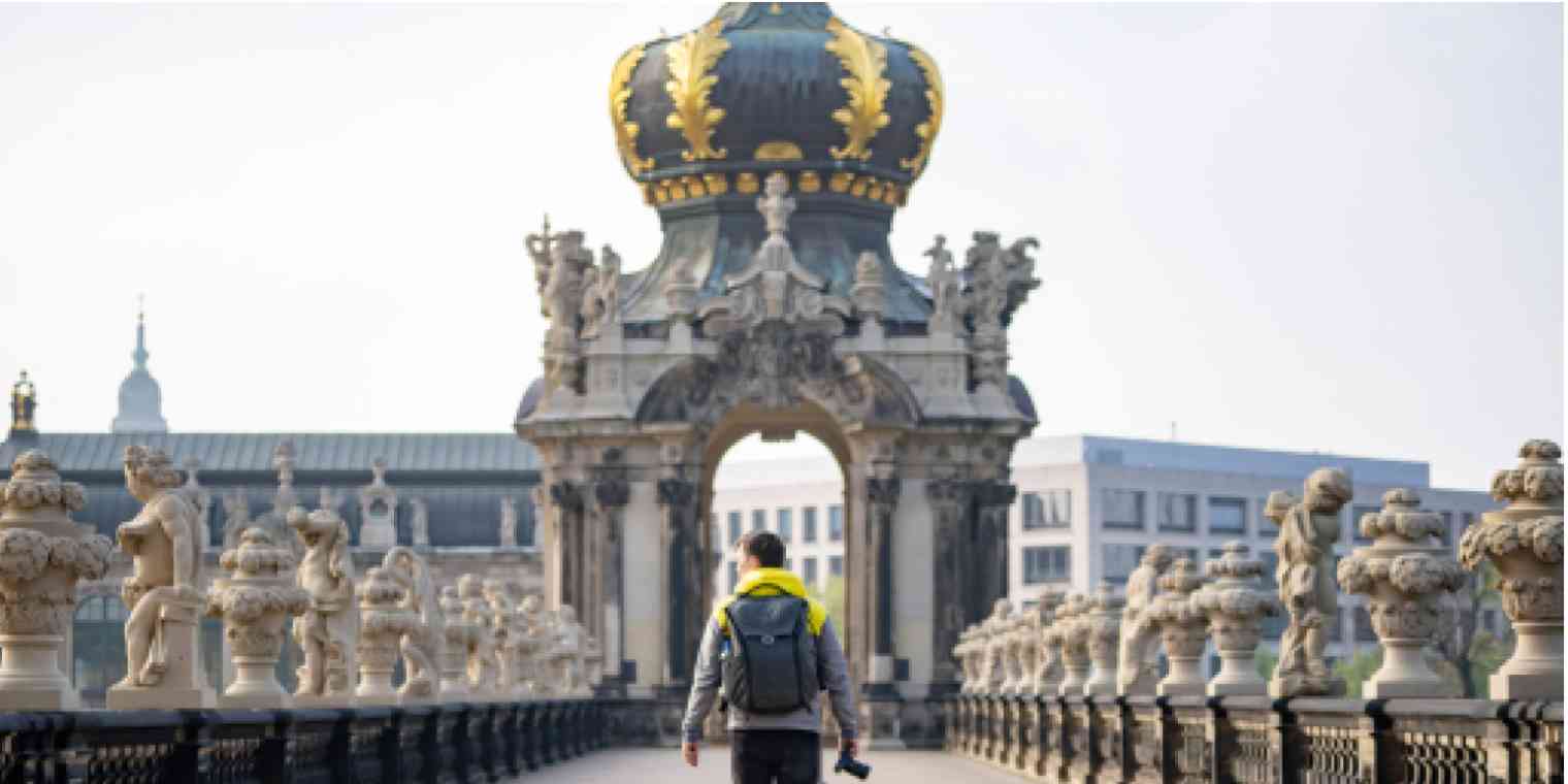 Hero image of a person walking in an Eastern European setting