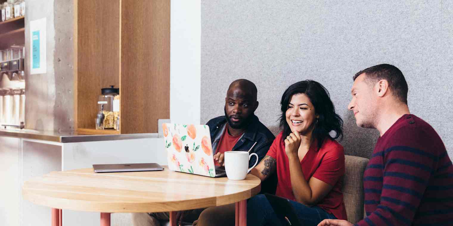 The Asana team working in their office.