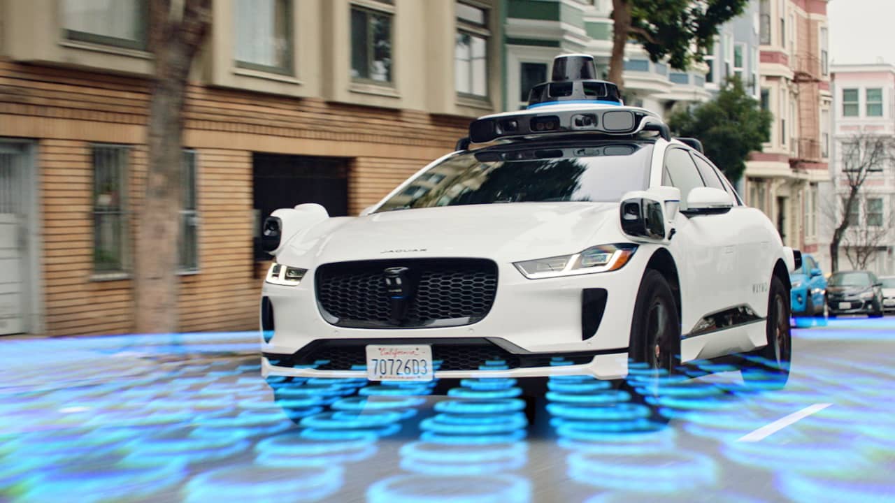 A Waymo self-driving car, an example of an AI agent operating in the real world.