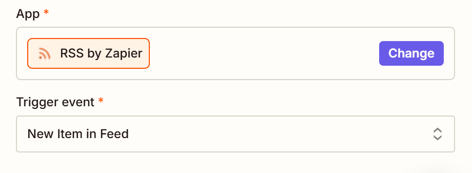 A trigger step in the Zap editor with RSS by Zapier selected for the trigger app and New Item in Feed selected for the trigger event.