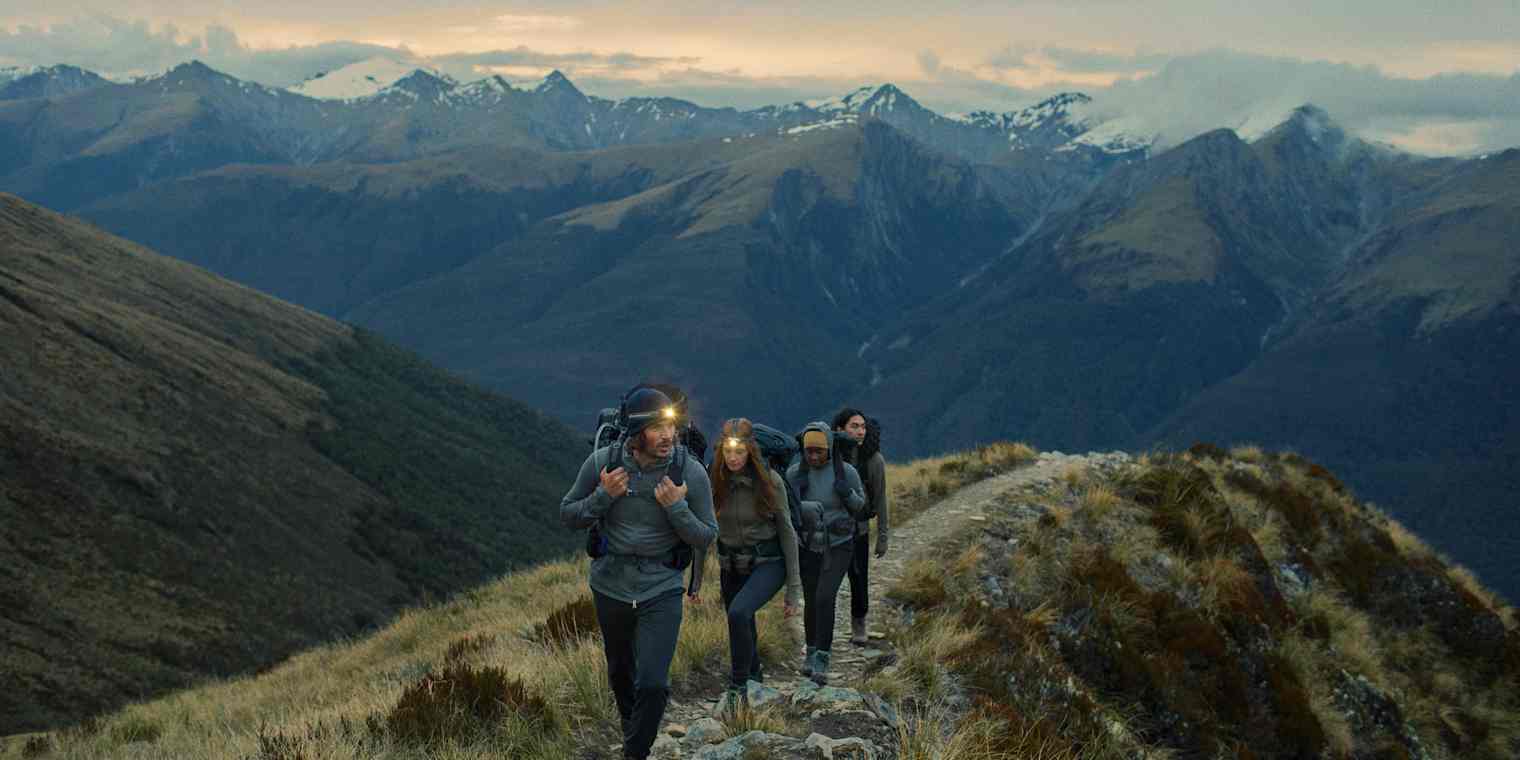 Icebreaker customers wearing outdoor gear on a mountain