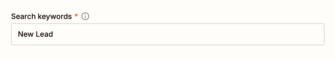 A zoomed-in image of a window in the Zap editor, with "New Lead" typed into the required field "Search keywords."