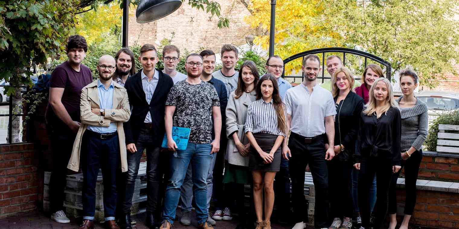 The 17-person DevsData team standing outside.