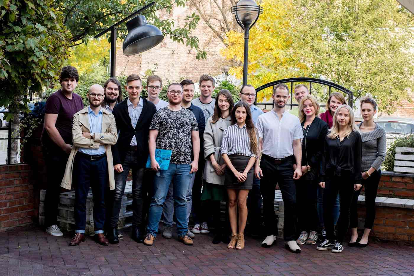 The 17-person DevsData team standing outside.