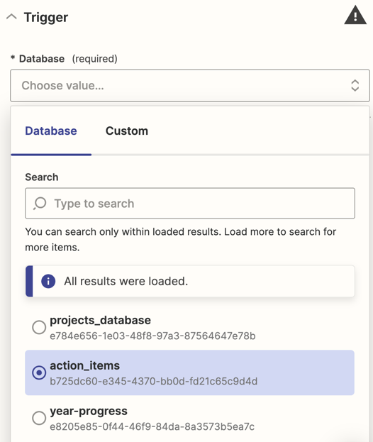 Screenshot of the Zap editor, setting up the trigger step by choosing the "action_items" database from the dropdown.
