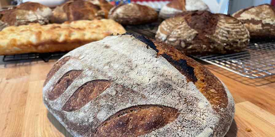 Hero image with breads from a home bakery