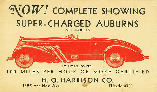 A vintage tradecard reading "Now! Complete showing super-charged Auburns" with additional details about the 