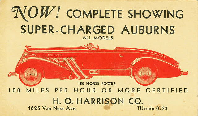 A vintage tradecard reading "Now! Complete showing super-charged Auburns" with additional details about the
