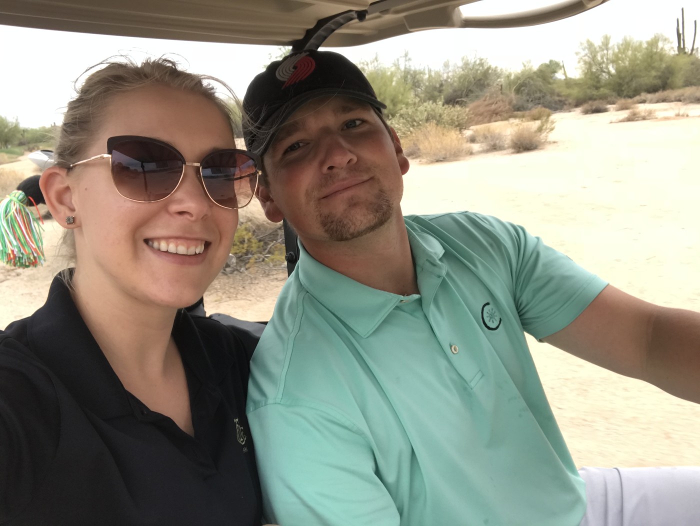 Jake and his wife in a golf cart