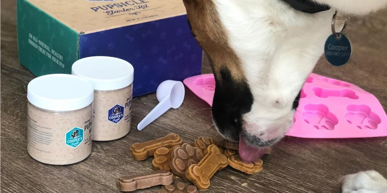 Hero image of a dog licking Cooper's Treats