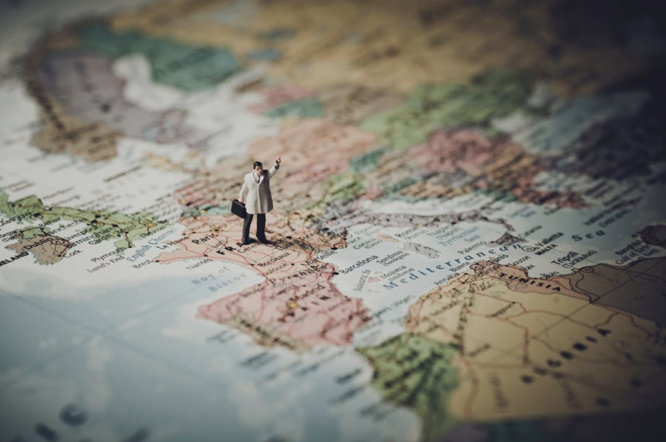 Figurine standing on a map