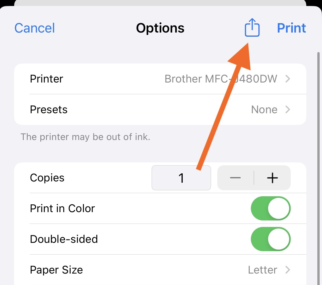 Print options screen on iPhone with an orange arrow pointing to the share icon in the top-right corner.