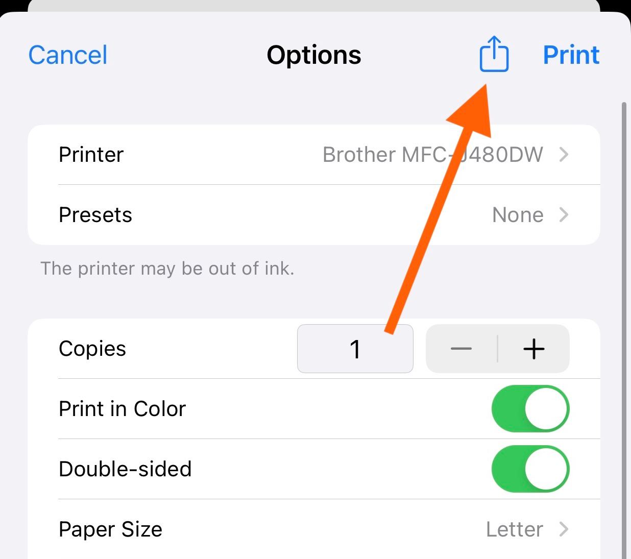 Print options screen on iPhone with an orange arrow pointing to the share icon in the top-right corner.