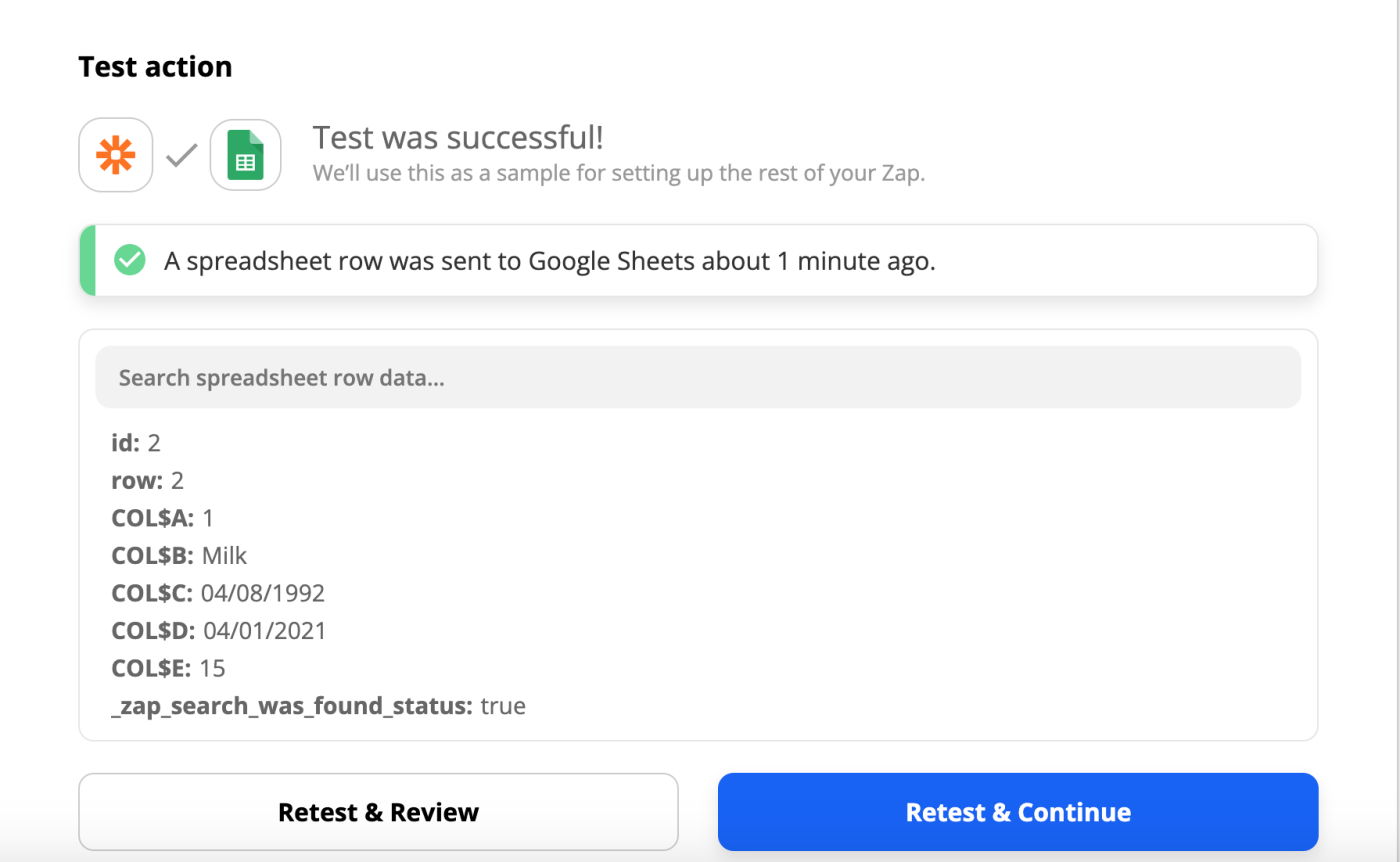 A successful test message which includes the text "Test was successful", the orange Zapier app icon, the green Google Sheets icon, and a blue button that reads "Retest & Continue".