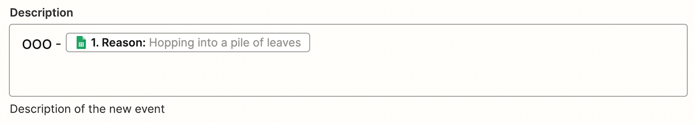 A screenshot of text and a field from Google Sheets mapped in the Description field. It reads "OOO -" and then shows an oval shape with the Google Sheets logo and information pulled from the spreadsheet.